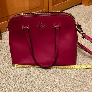 Berry colored Kate Spade shoulder bag. Used very good condition no marks.